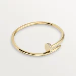 Cartier / JUSTE UN CLOU BRACELET Juste un Clou bracelet, classic, 18K yellow gold (750/1000), set with 32 brilliant-cut diamonds totaling 0.58 carat. Width: 3.5 mm (for size 17).